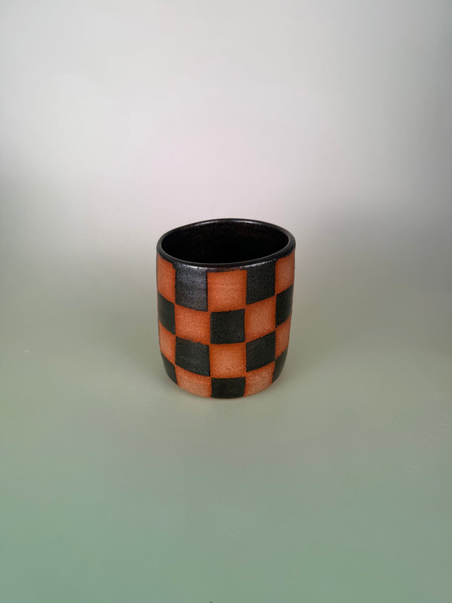 Black sparkly checkered cup