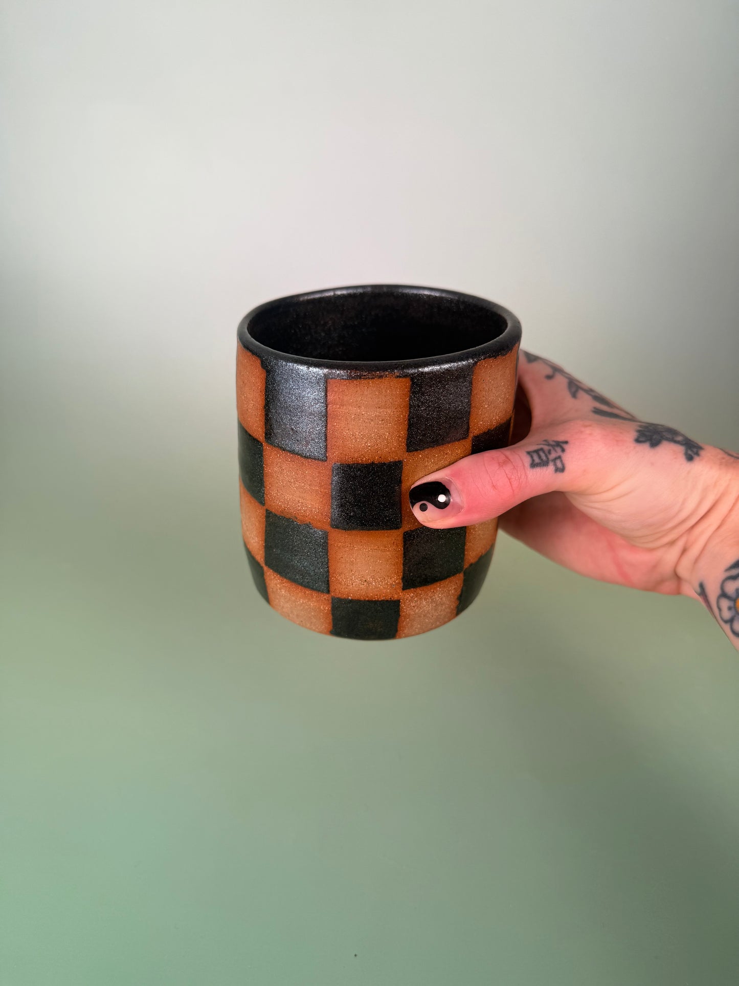 Black sparkly checkered cup