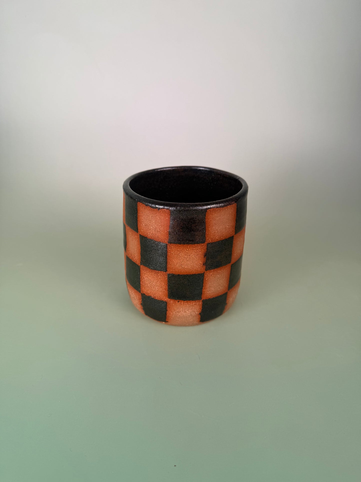 Black sparkly checkered cup